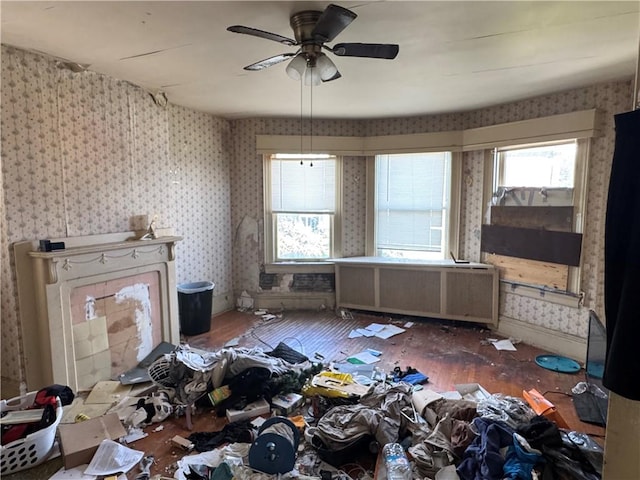 2019 Jenny Lind St, Mckeesport, PA 15132 - living area featuring wallpapered walls, healthy amount of natural light, wood finished floors, and a ceiling fan
