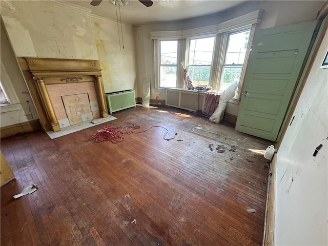 2019 Jenny Lind St, Mckeesport, PA 15132 - unfurnished living room featuring hardwood / wood-style flooring, ceiling fan, ornamental molding, and a tiled fireplace