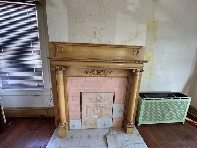 2019 Jenny Lind St, Mckeesport, PA 15132 - detailed view of wood finished floors and radiator heating unit
