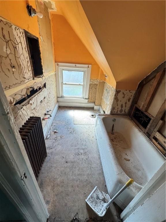 2019 Jenny Lind St, Mckeesport, PA 15132 - bathroom with a bath and lofted ceiling
