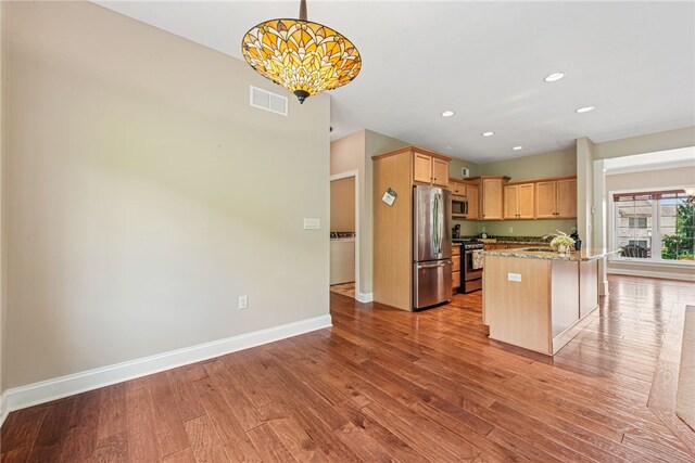 416 Willow Ct, Allegheny Twp, PA 15613 - kitchen featuring stainless steel appliances, wood finished floors, light stone counters, recessed lighting, and pendant lighting