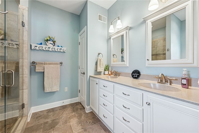 416 Willow Ct, Allegheny Twp, PA 15613 - bathroom featuring a stall shower, double vanity, and stone finish floors