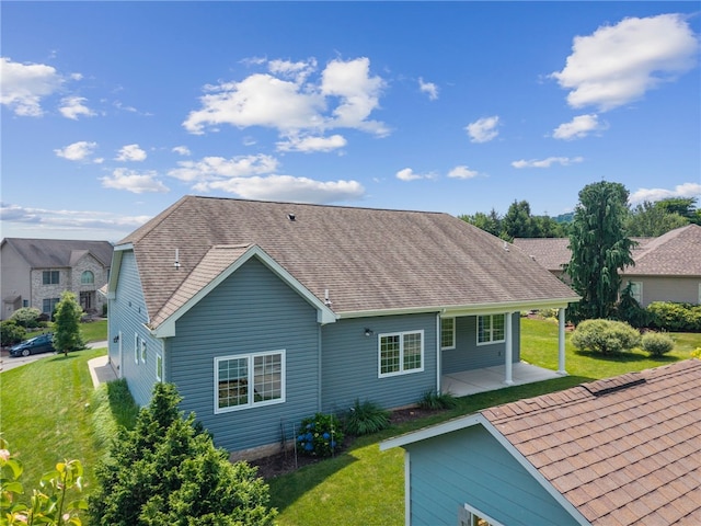 416 Willow Ct, Allegheny Twp, PA 15613 - back of property featuring a patio, a yard, and a shingled roof