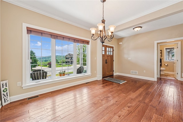 416 Willow Ct, Allegheny Twp, PA 15613 - foyer featuring a chandelier, crown molding, and hardwood / wood-style floors