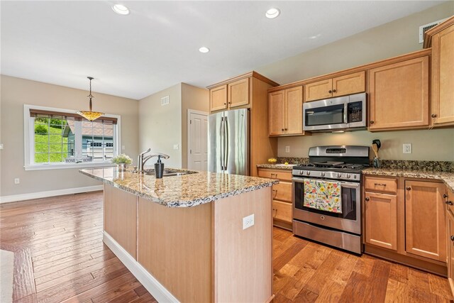 416 Willow Ct, Allegheny Twp, PA 15613 - kitchen featuring stainless steel appliances, light stone countertops, light wood-type flooring, a center island with sink, and recessed lighting