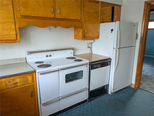308 E Highland Ave, Ebensburg, PA 15931 - kitchen with white appliances, brown cabinetry, dark floors, and baseboard heating