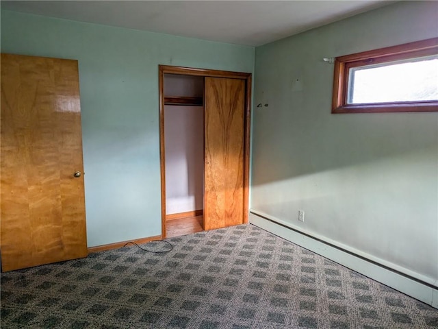 308 E Highland Ave, Ebensburg, PA 15931 - unfurnished bedroom featuring a baseboard heating unit, carpet, and a closet