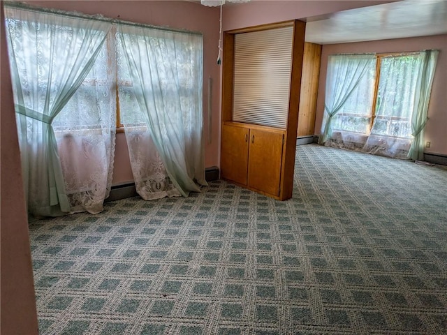 308 E Highland Ave, Ebensburg, PA 15931 - carpeted empty room with a baseboard heating unit