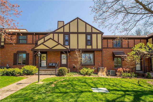 507 Sewickley Heights Dr, Aleppo, PA 15143 - tudor home featuring a front lawn, a chimney, and brick siding