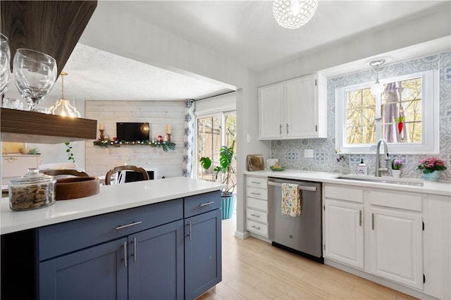 507 Sewickley Heights Dr, Aleppo, PA 15143 - kitchen with dishwasher, white cabinetry, light countertops, and light wood-type flooring