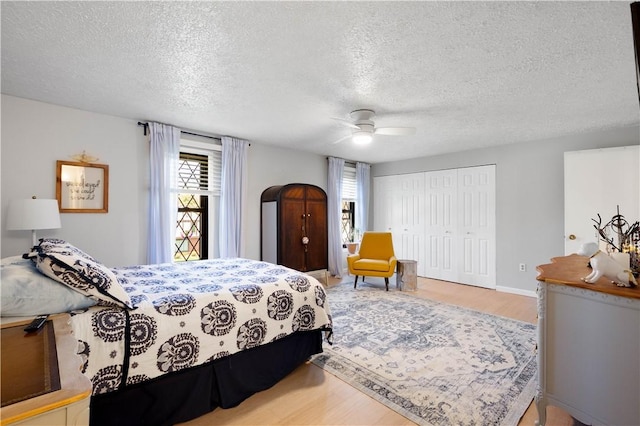 507 Sewickley Heights Dr, Aleppo, PA 15143 - bedroom featuring a textured ceiling, wood finished floors, a closet, and a ceiling fan