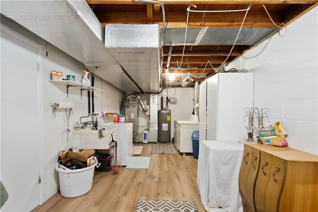 507 Sewickley Heights Dr, Aleppo, PA 15143 - unfinished basement with electric water heater, light wood-style floors, and heating unit