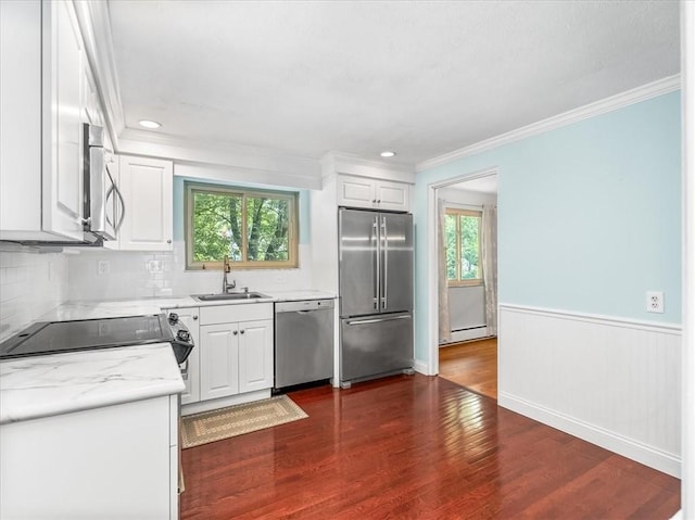 119 Abington Dr, Mt Lebanon, PA 15216 - kitchen with appliances with stainless steel finishes, plenty of natural light, light countertops, dark wood-style flooring, and crown molding