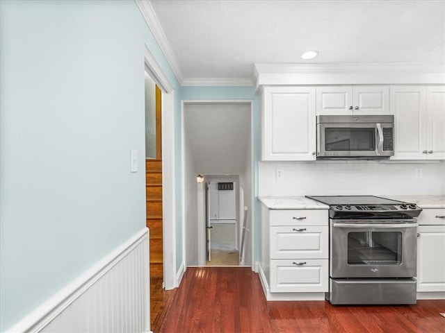 119 Abington Dr, Mt Lebanon, PA 15216 - kitchen featuring appliances with stainless steel finishes, crown molding, dark wood-type flooring, and white cabinets
