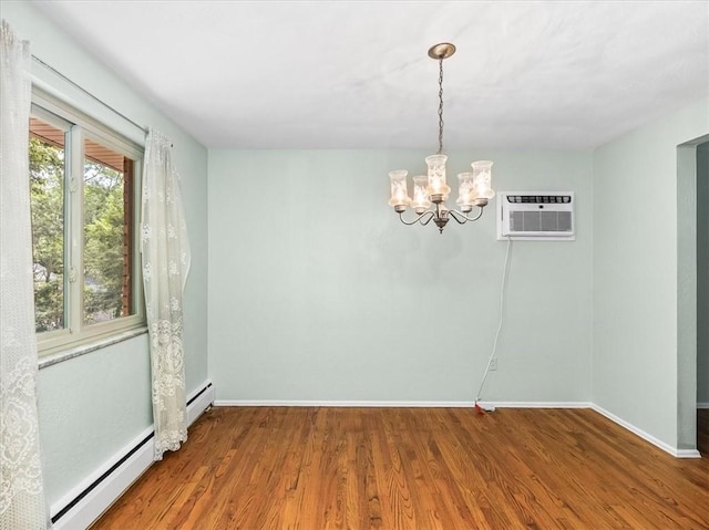 119 Abington Dr, Mt Lebanon, PA 15216 - unfurnished room featuring an AC wall unit, a baseboard radiator, wood finished floors, and a chandelier
