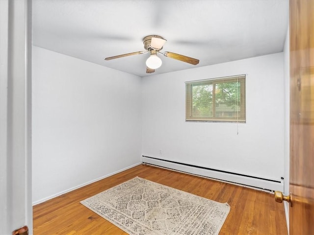 119 Abington Dr, Mt Lebanon, PA 15216 - unfurnished room with a baseboard heating unit, ceiling fan, and wood finished floors