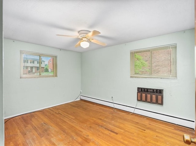 119 Abington Dr, Mt Lebanon, PA 15216 - unfurnished room featuring a baseboard radiator, plenty of natural light, wood finished floors, and a ceiling fan