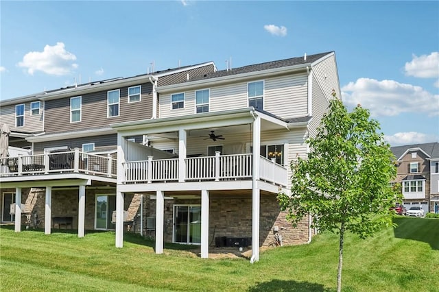 306 Helenium Dr, Adams Twp, PA 16046 - rear view of property with a deck, a yard, stone siding, and a ceiling fan