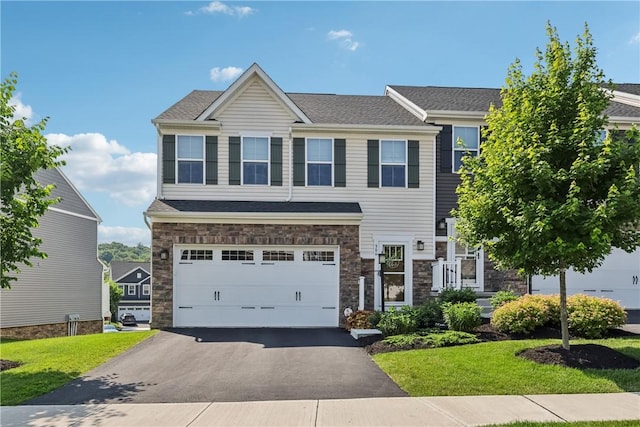 306 Helenium Dr, Adams Twp, PA 16046 - craftsman-style home featuring driveway, stone siding, an attached garage, and a front lawn