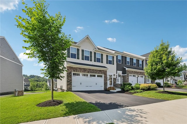 306 Helenium Dr, Adams Twp, PA 16046 - view of front of home with an attached garage, driveway, stone siding, and a front yard
