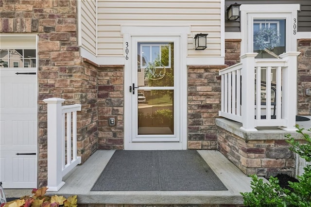 306 Helenium Dr, Adams Twp, PA 16046 - entrance to property featuring a garage and stone siding