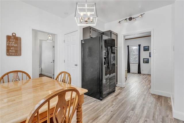 203 Stoney Hollow Rd, Winfield Twp, PA 16023 - dining space with a chandelier and light wood-style floors
