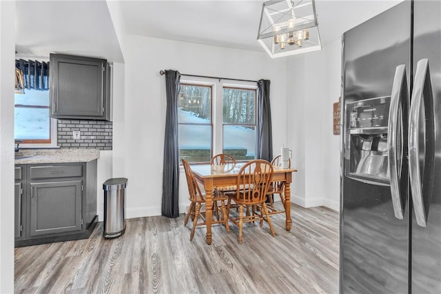 203 Stoney Hollow Rd, Winfield Twp, PA 16023 - dining room with light wood finished floors and a chandelier