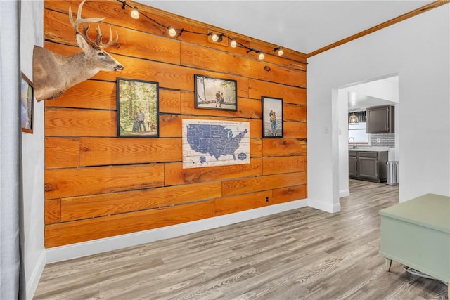 203 Stoney Hollow Rd, Winfield Twp, PA 16023 - corridor with crown molding, light wood-style floors, and wooden walls
