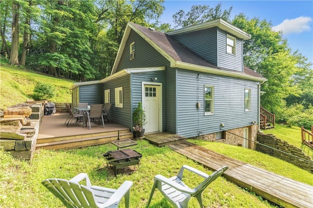 203 Stoney Hollow Rd, Winfield Twp, PA 16023 - back of house featuring a deck, a yard, and outdoor dining area