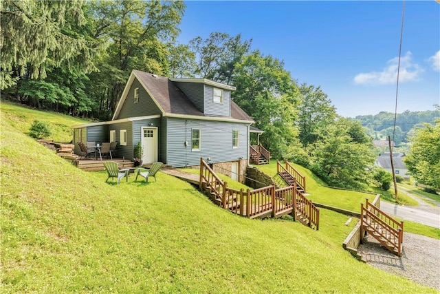 203 Stoney Hollow Rd, Winfield Twp, PA 16023 - back of property with stairs, a yard, and a wooden deck