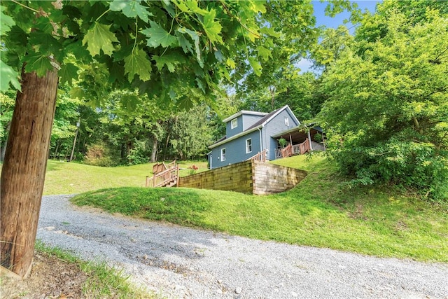 203 Stoney Hollow Rd, Winfield Twp, PA 16023 - view of home's exterior featuring a lawn