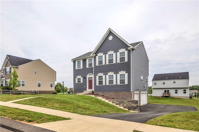 115 Cottonwood Dr, Brighton Twp, PA 15009 - colonial inspired home featuring a garage, asphalt driveway, a front lawn, and entry steps