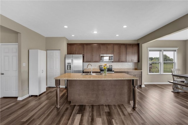 115 Cottonwood Dr, Brighton Twp, PA 15009 - kitchen featuring stainless steel appliances, dark wood-style floors, a kitchen island with sink, backsplash, and recessed lighting