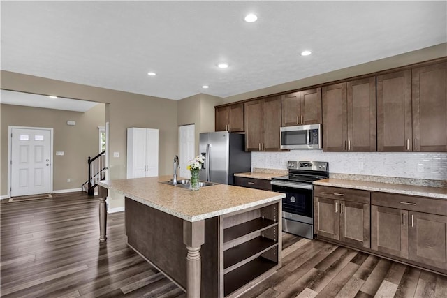 115 Cottonwood Dr, Brighton Twp, PA 15009 - kitchen featuring appliances with stainless steel finishes, open shelves, dark wood-type flooring, decorative backsplash, and recessed lighting