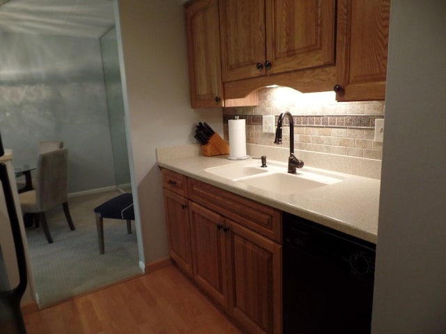 2160 Greentree Rd Unit 701W, Pittsburgh, PA 15220 - kitchen with dishwasher, tasteful backsplash, light countertops, and light wood-style floors