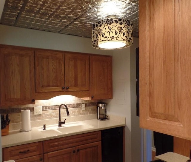 2160 Greentree Rd Unit 701W, Pittsburgh, PA 15220 - kitchen featuring tasteful backsplash, an ornate ceiling, light countertops, brown cabinetry, and black dishwasher