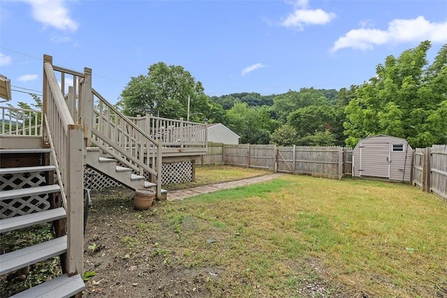 107 Ambridge Ave, Leet Twp, PA 15003 - fenced backyard featuring stairway, a storage unit, and a deck