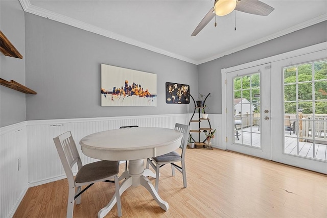 107 Ambridge Ave, Leet Twp, PA 15003 - dining area with wood finished floors, ornamental molding, wainscoting, french doors, and a ceiling fan