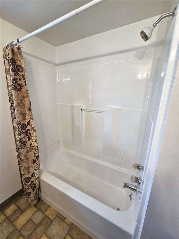 596 Beech St, City Of Washington, PA 15301 - full bathroom featuring shower / tub combo and stone finish flooring
