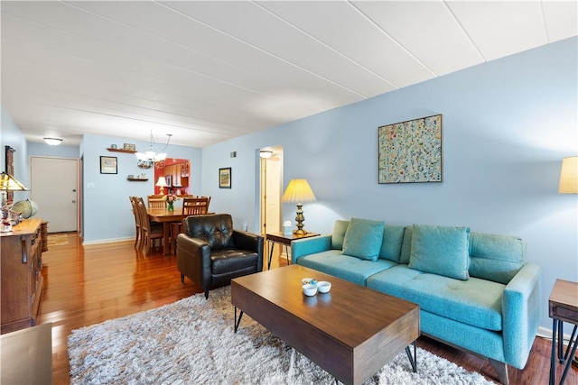 2034 Swallow Hill Rd Unit 419, Pittsburgh, PA 15220 - living area with wood finished floors and a chandelier