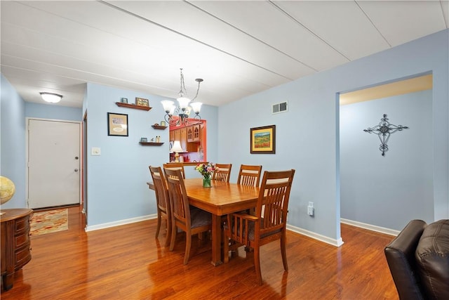 2034 Swallow Hill Rd Unit 419, Pittsburgh, PA 15220 - dining area with wood finished floors and a chandelier