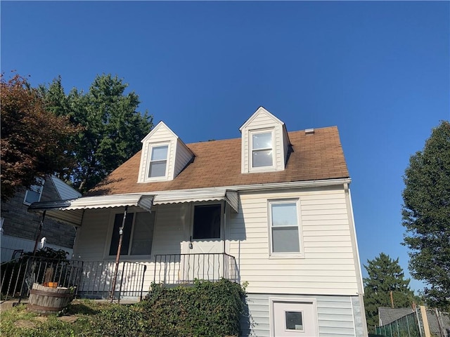 120 Graham Ave N, Versailles, PA 15137 - cape cod home featuring a porch