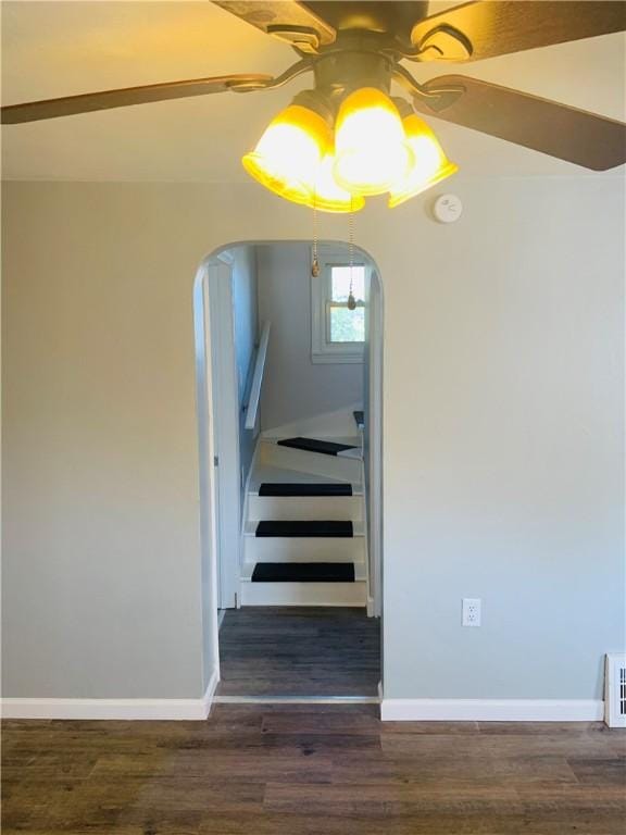 120 Graham Ave N, Versailles, PA 15137 - stairway with arched walkways, a ceiling fan, and wood finished floors