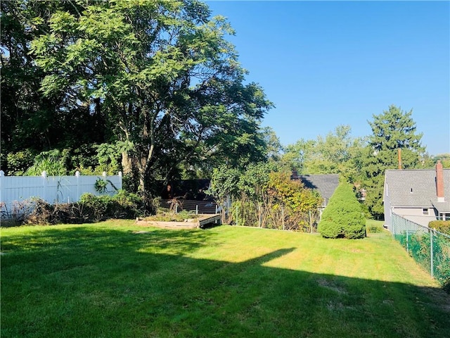 120 Graham Ave N, Versailles, PA 15137 - fenced backyard with a garden