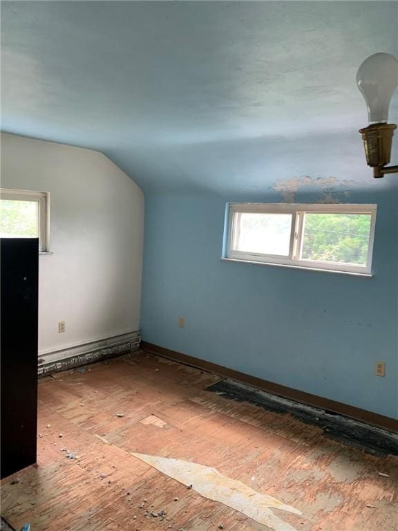 1309 Denise St, Overbrook, PA 15210 - spare room featuring vaulted ceiling and a baseboard heating unit