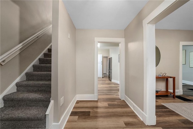 1122 Wade St, Aliquippa, PA 15001 - staircase featuring wood finished floors and baseboards