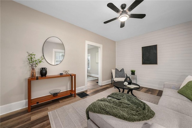 1122 Wade St, Aliquippa, PA 15001 - living area featuring a ceiling fan, wood finished floors, and an accent wall