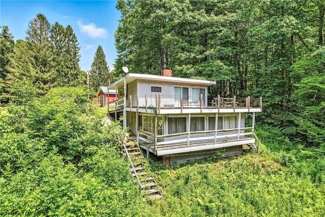 3067 N 3rd St, Jamestown, PA 16134 - rear view of property with a chimney, a deck, and a forest view