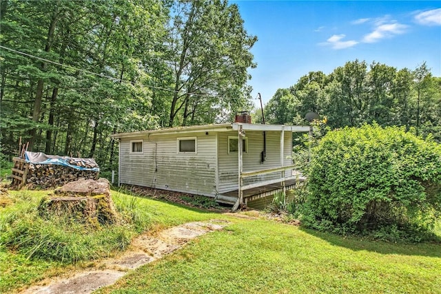 3067 N 3rd St, Jamestown, PA 16134 - view of side of home with a yard and a chimney