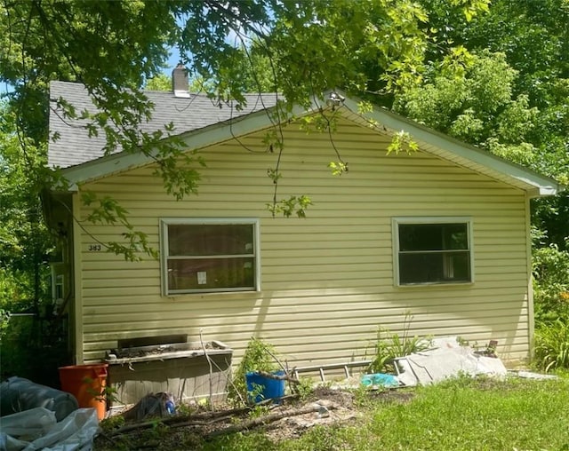 383 Walbridge St, Harborcreek Twp, PA 16511 - view of property exterior featuring a chimney